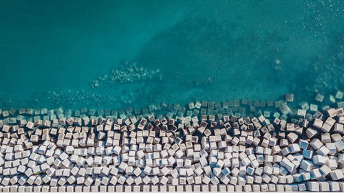Aerial view of cement cube blocks protecting the shore from the