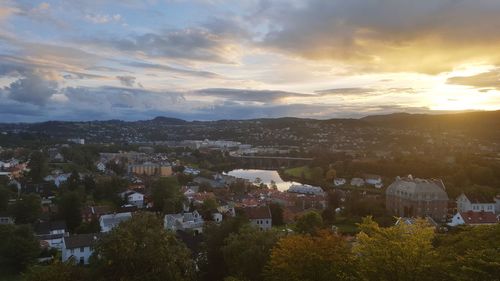 View of cityscape against sky at sunset