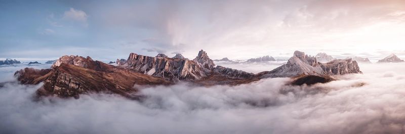 Scenic view of mountains against cloudy sky