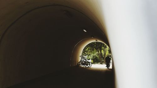 Rear view of man in tunnel