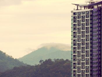 Skyscrapers in city against sky