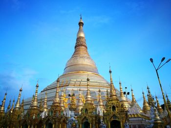 Low angle view of pagoda against blue sky