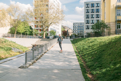 Full length of woman walking on walkway