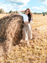 Full length of woman standing on field