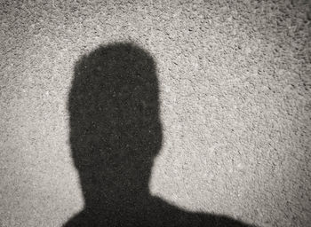 Shadow of man on wall