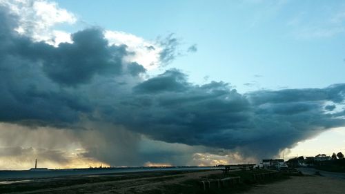 Scenic view of sea against cloudy sky