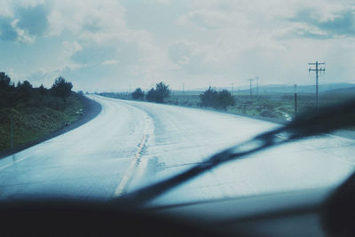 Empty road against sky