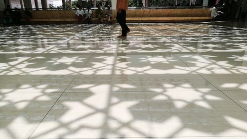 Low section of woman standing on floor