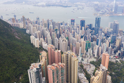 High angle view of modern buildings in city against sky