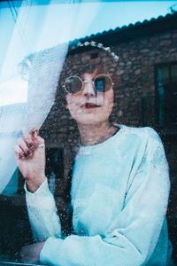 Portrait of young man wearing sunglasses