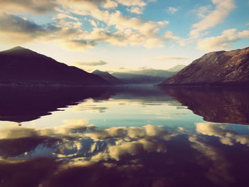 Scenic view of lake against sky during sunset