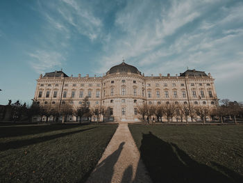 Facade of historic building against sky