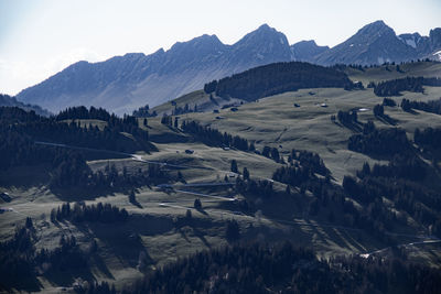 Scenic view of landscape and mountains against sky