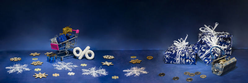 Christmas decoration on table against blue background