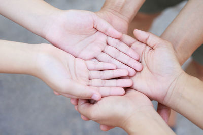 Cropped image of couple holding hands