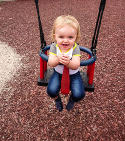 Portrait of cute boy playing on playground