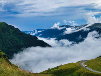 Scenic view of snowcapped mountains against sky