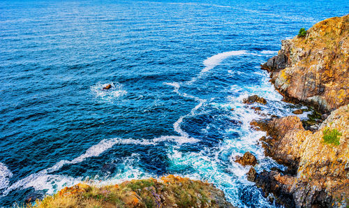 High angle view of rock formation in sea