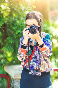 Midsection of woman photographing