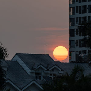 Low angle view of buildings against sky during sunset