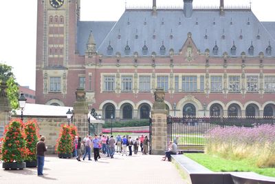 People walking in front of building