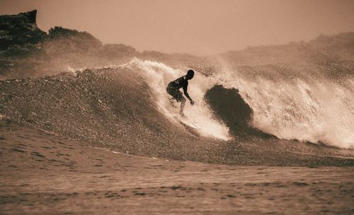 Man surfing on wave