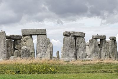 Built structure on field against sky