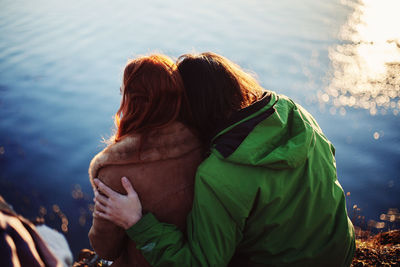 Rear view of couple in water