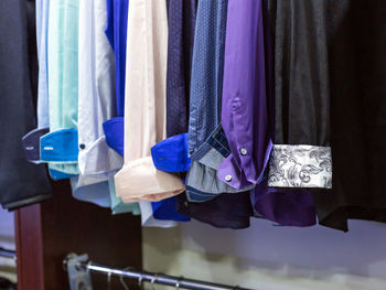 Close-up of clothes hanging in store