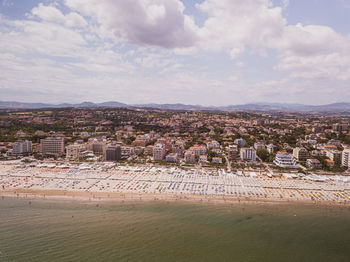 Aerial view of city against sky