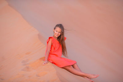 Portrait of smiling young woman on land