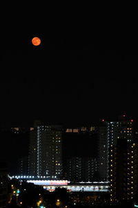 Illuminated cityscape at night