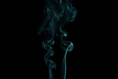 Close-up of smoke against black background