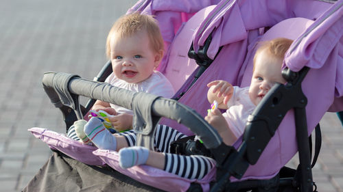 Close-up of cute baby girl sitting in park