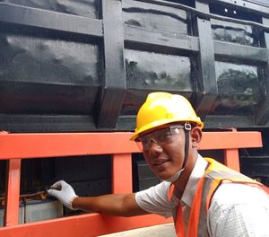 Portrait of man working at construction site