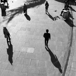 High angle view of people walking on street