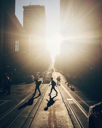 People on city street during sunset