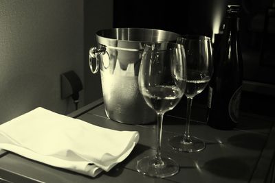 Close-up of wine glasses on table