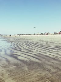 Scenic view of beach against clear sky