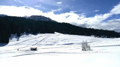 Scenic view of snow covered mountains against sky