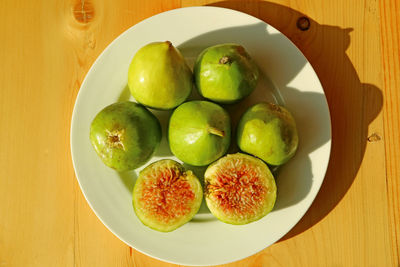 High angle view of fruits in plate on table