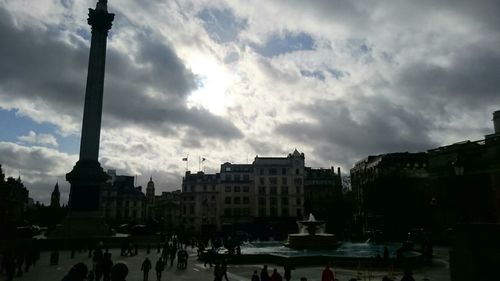 City street against cloudy sky