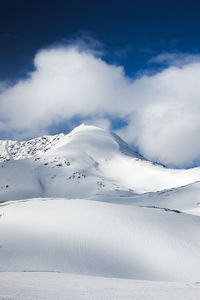 Snow covered mountain against sky