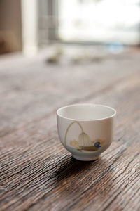 Close-up of coffee cup on table