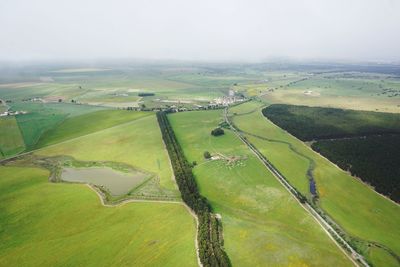 Aerial view of agricultural field against sky