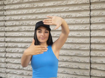 Young woman making a frame with her hands