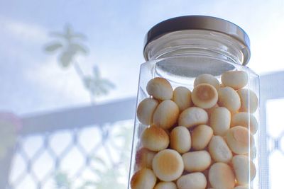 Close-up of eggs in glass jar on table