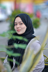 Portrait of young woman looking away