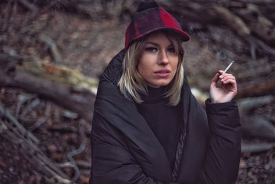 Portrait of young woman in forest