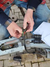 Midsection of man working at workshop